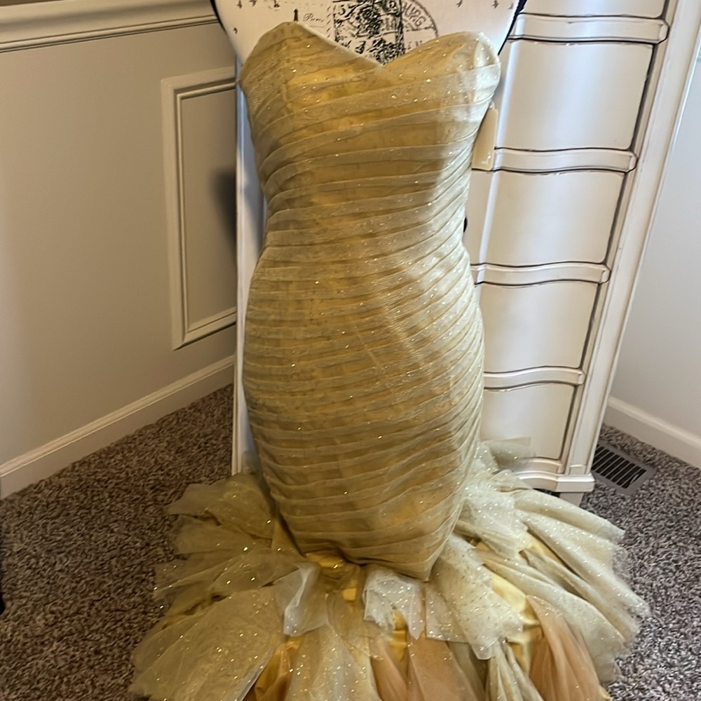 Gold strapless mermaid-style formal gown with a ruffled tulle skirting - Picture 10 of 11